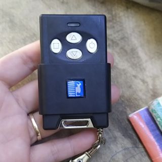 Khiển cửa cuốn chống trộm Austdoor sóng 315 Hàng Fake 1.1