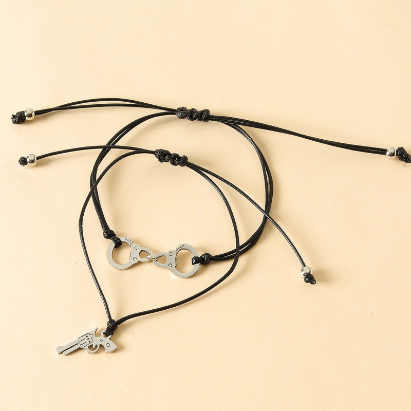 Vòng Cổ Choker Bằng Thép Không Gỉ Hình Còng Tay Và Súng Lục Độc Đáo