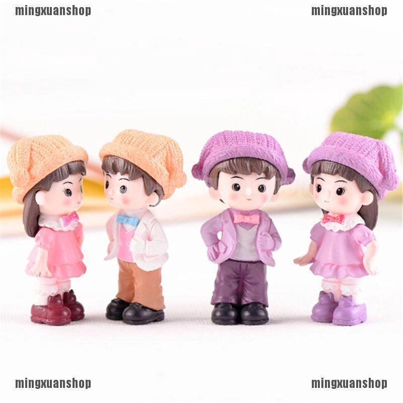 Mô hình cặp đôi đội mũ trang trí vườn