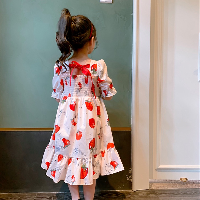 Đầm IQ ANGEL tay phồng đính nơ sau lưng họa tiết dâu tây ngọt ngào dành cho trẻ em