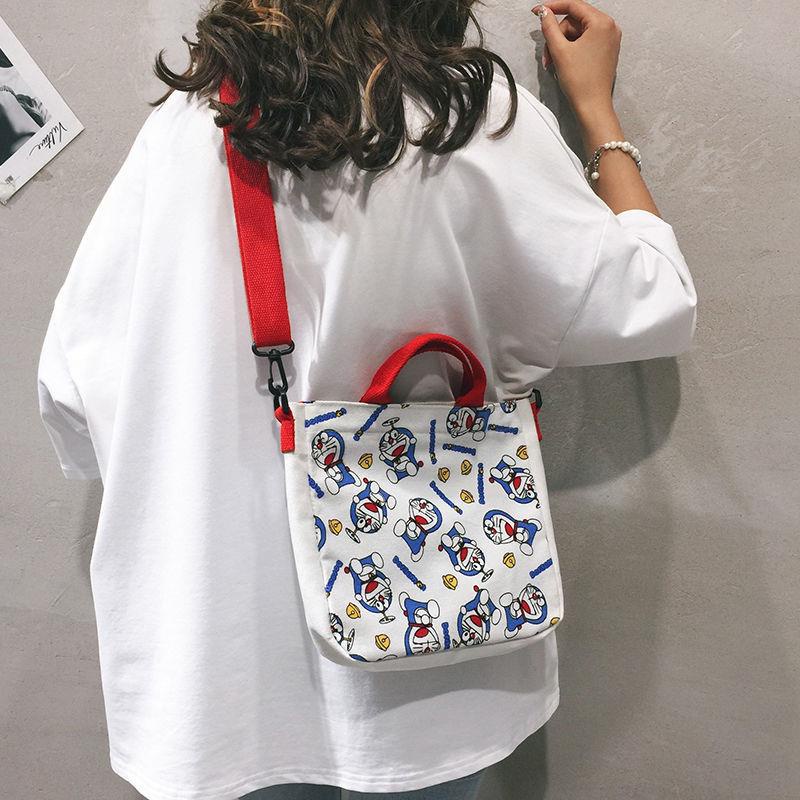 Túi Đeo Chéo Vải Canvas In Hình Doraemon Dễ Thương Phong Cách Nhật Bản 2020 Cho Nữ