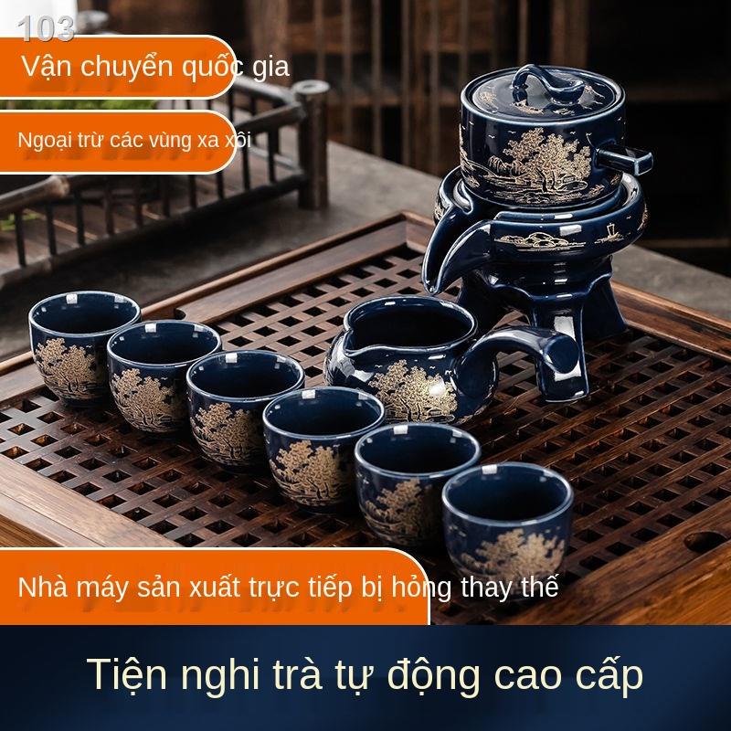 Eđặc biệt lười đá men ngọc cối xay nước tự động xoay Bộ trà kungfu cát tím trọn ấm chén gốm sứ