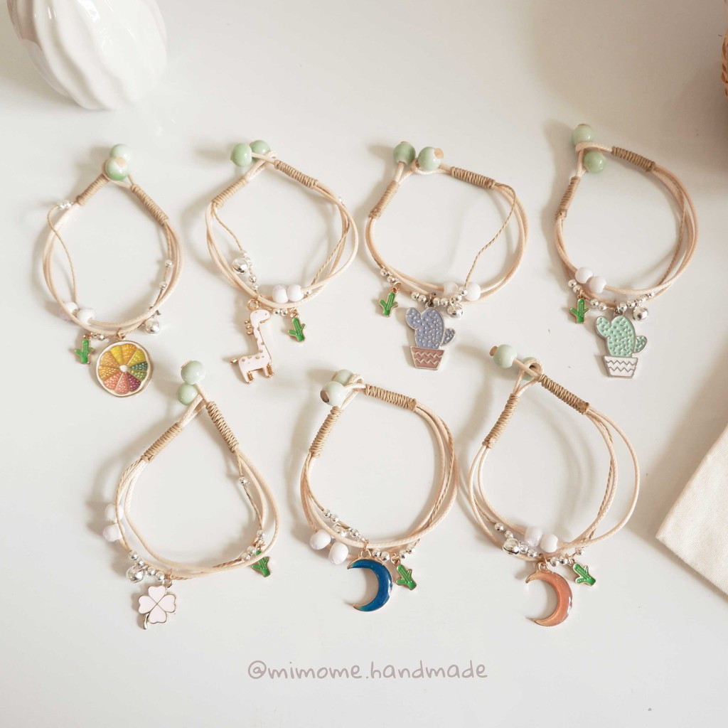 Vòng gốm nút gài phối charm màu xinh xắn