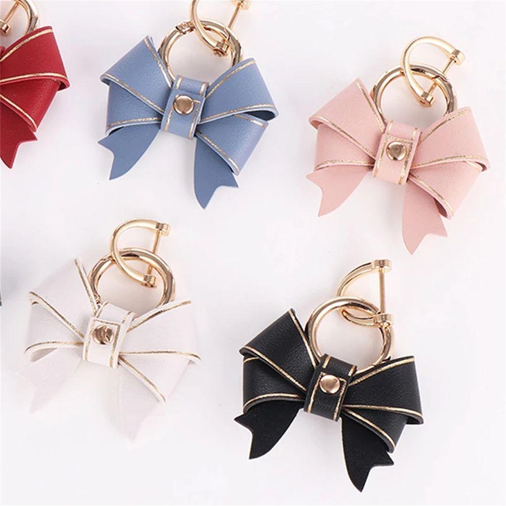 Móc Chìa Khóa Bằng Da Hình Nơ Sáng Tạo Chống Thất Lạc