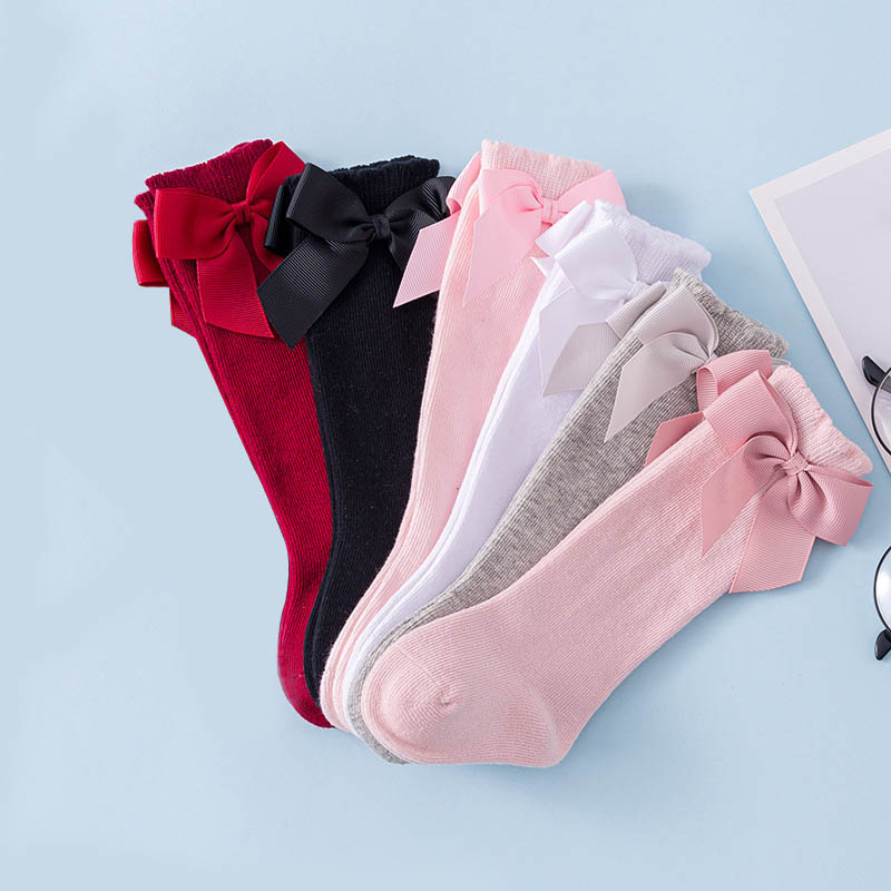 Đôi vớ cotton cổ cao tới đầu gối đính nơ thời trang thu đông xinh xắn dành cho trẻ em