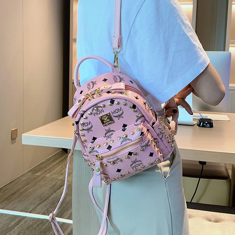 Đinh tán Mini Shoulder Bag Nữ 2020 Phiên bản tiếng Hàn mới của hàng trăm ba lô nhỏ Túi du lịch đa túi QI cao cấp