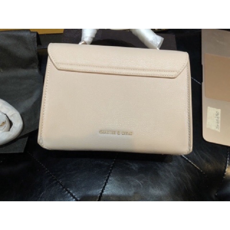 Túi cnk nơ hồng Nude