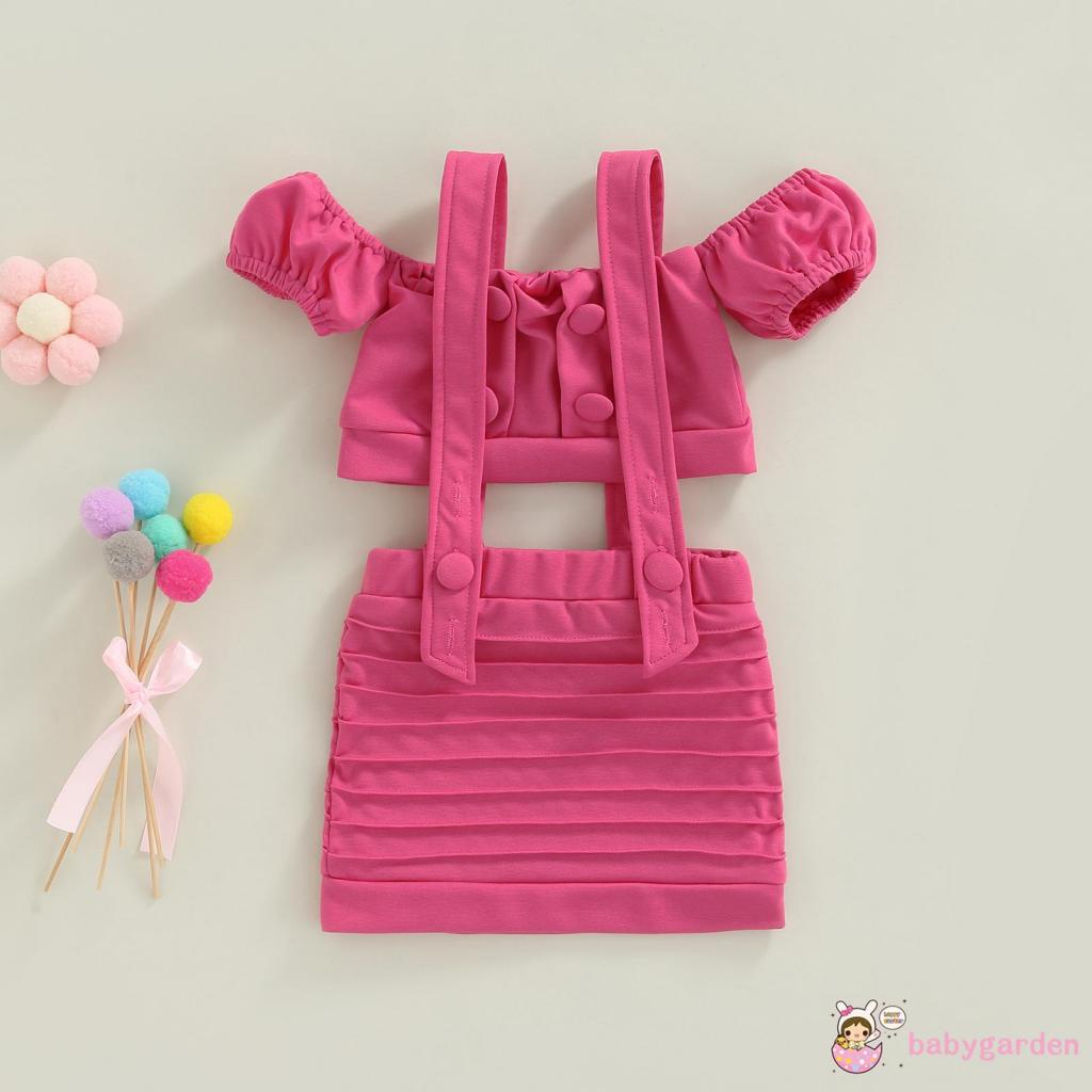 Set Đồ 2 Món Gồm Áo Croptop Tay Ngắn Trễ Vai Cài Nút + Chân Váy Yếm Có Nút Màu Trơn Cho Bé Gái 2-7 Tuổi