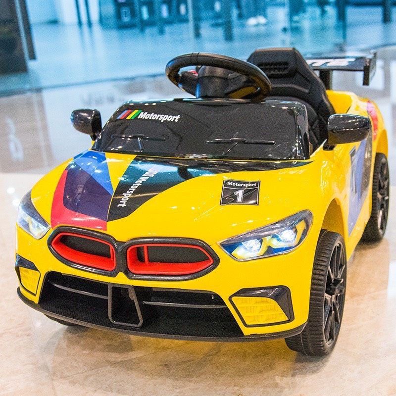 Ô tô điện mini kiểu đang BMW( có điều khiển từ xa, chế độ tự đạp ga lái, đèn, còi, nhạc, cổng Usb tích hợp...)