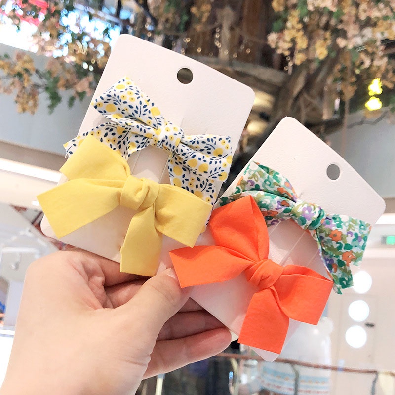 Set 2 Kẹp Tóc Nơ Hoa Màu Trơn Nhỏ Xinh Điệu Đà Cho Nữ