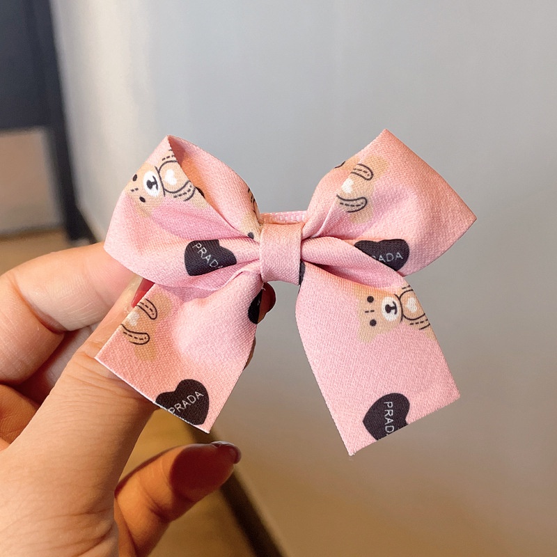 Kẹp tóc hình nơ màu đỏ sữa cà phê xinh xắn cho bé gái