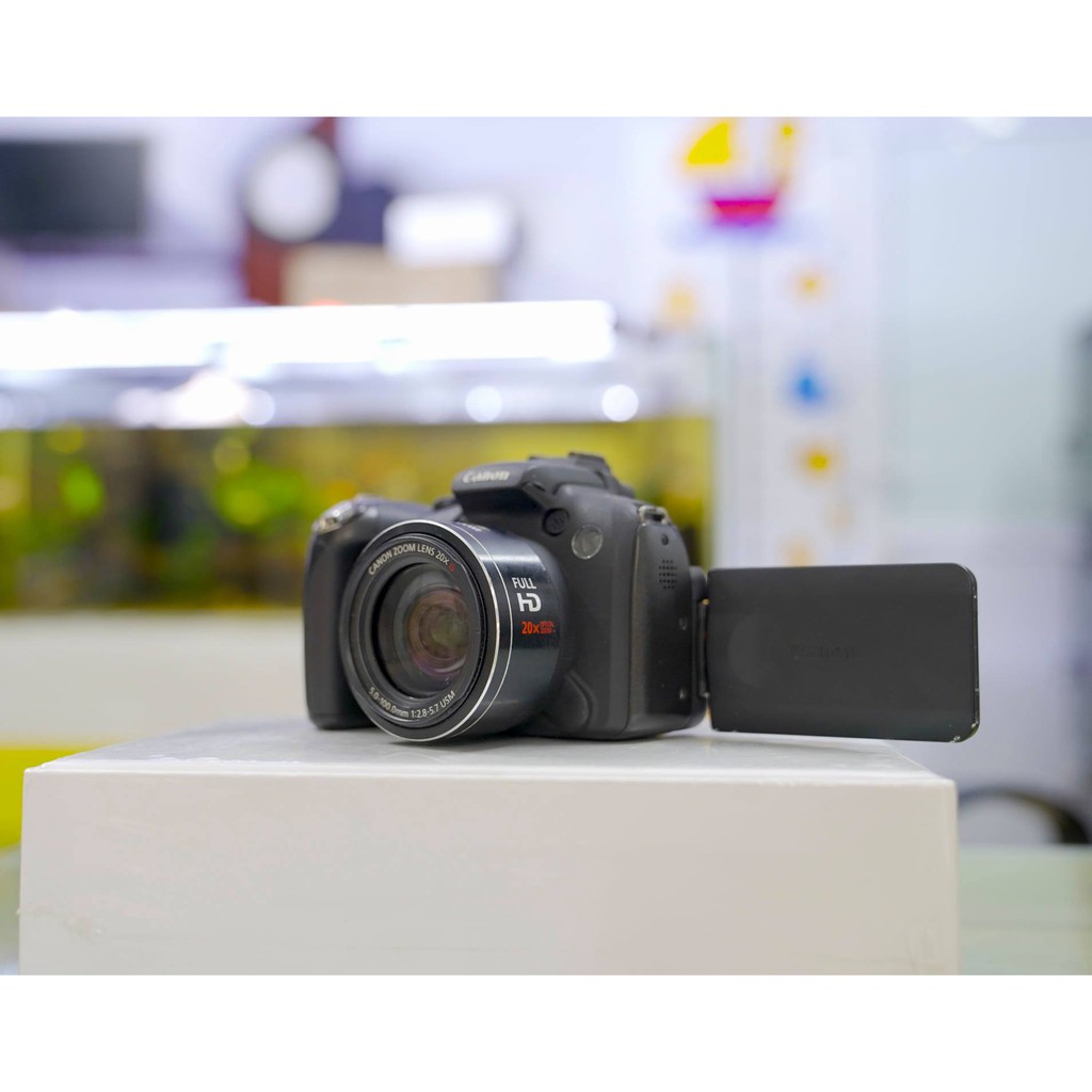 Máy ảnh Canon SX1 IS . Màn hình xoay lật. Quay video Full HD. ống kính siêu Zoom nhỏ gọn tiện dụng