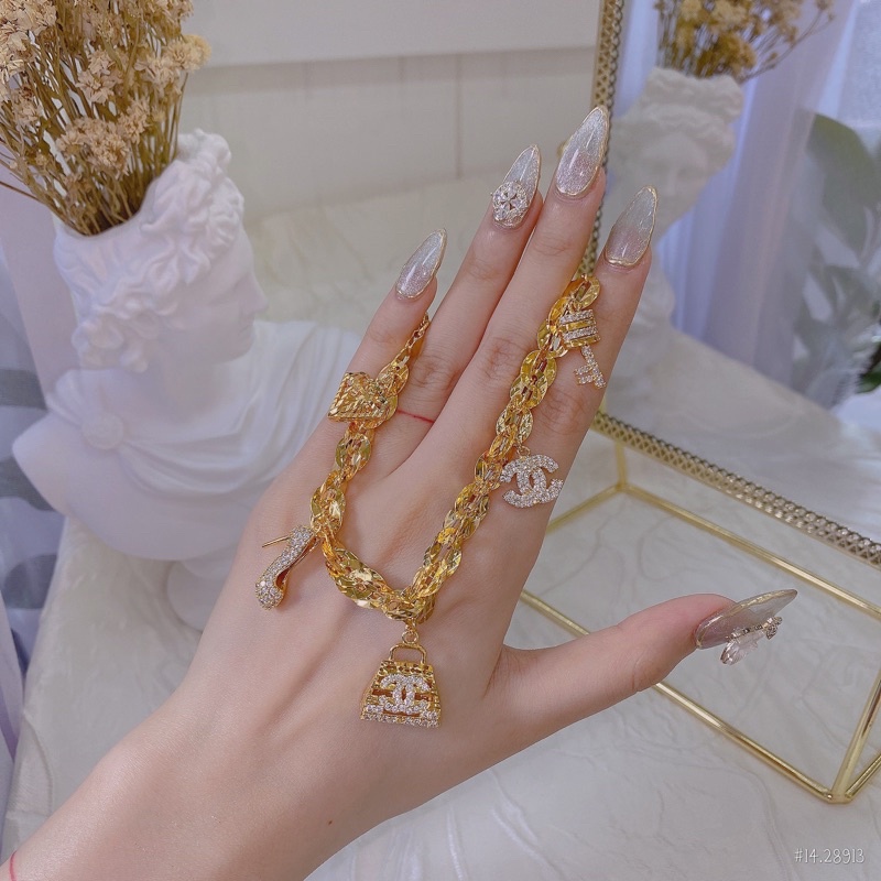 Lắc tay xoắn lá 4D xi bạch kim, xi mạ vàng đính charm túi thương hiệu .PTNACC.