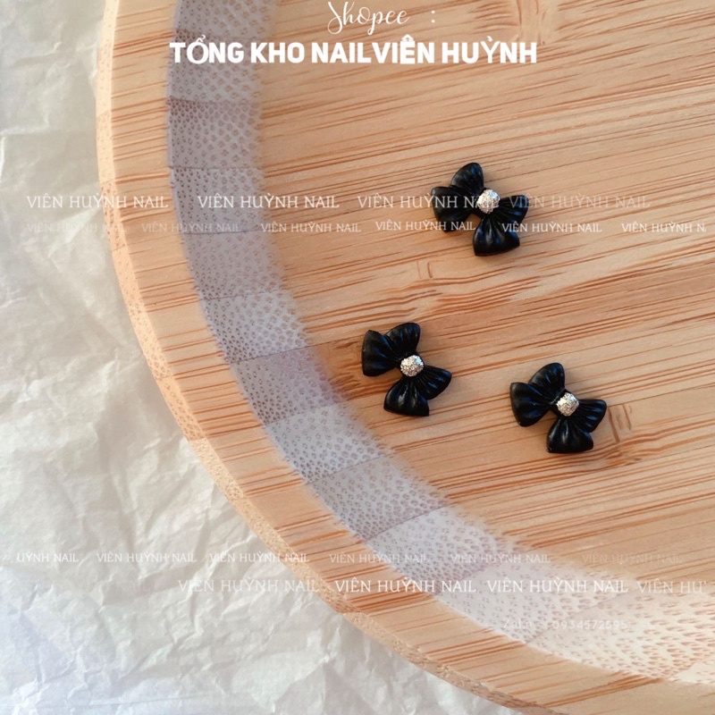 Set 20 cái nơ nhựa  gắn móng trắng đen