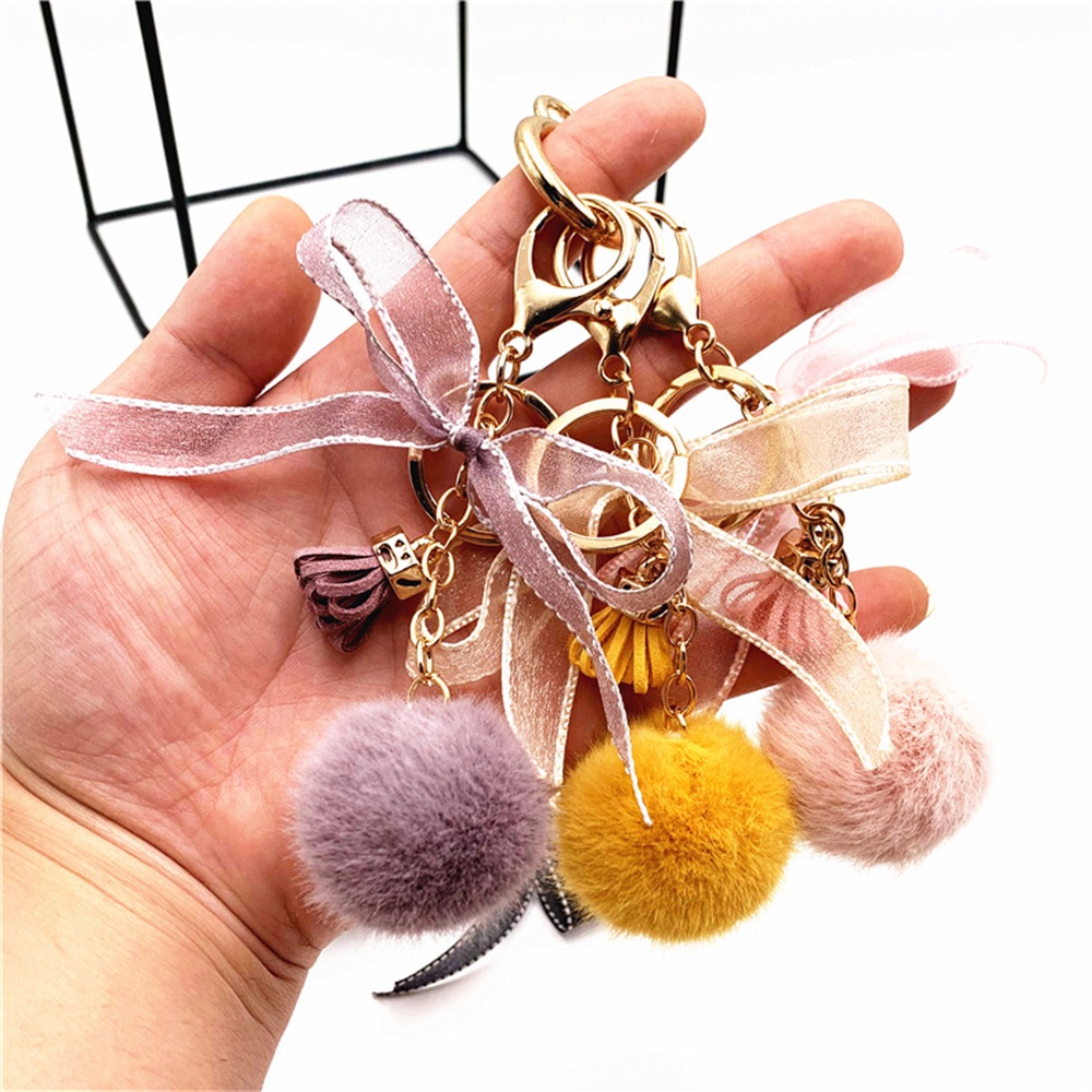 Móc Khóa Hình Quả Cầu Lông Xù Phối Nơ Ren Tua Rua Dễ Thương Dùng Trang Trí