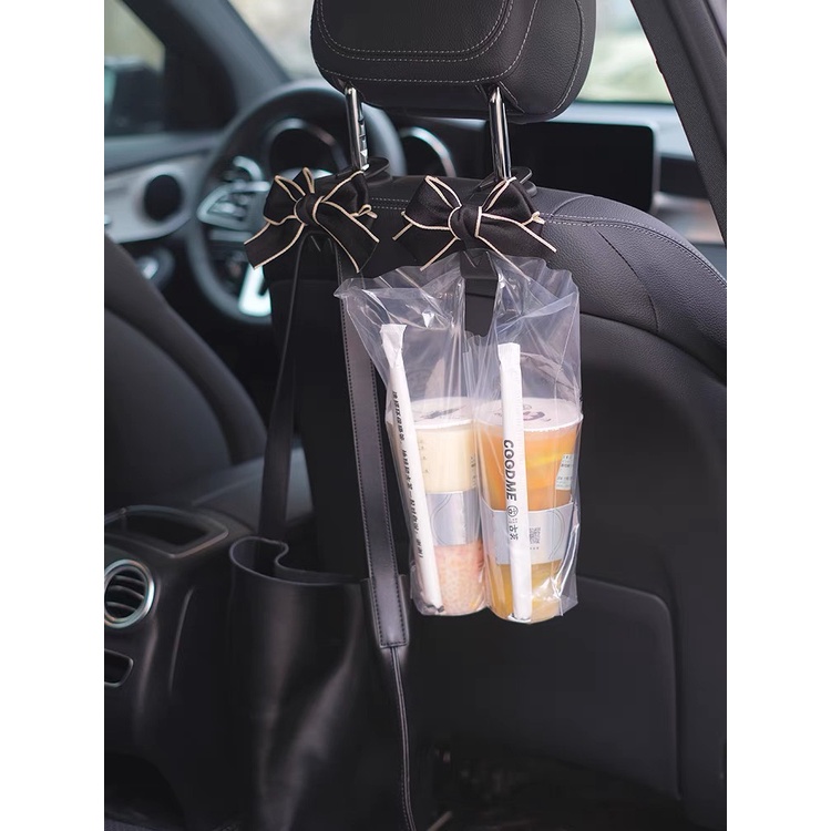 Móc treo đồ sau ghế xe ô tô - Móc treo đồ xe hơi hình nơ