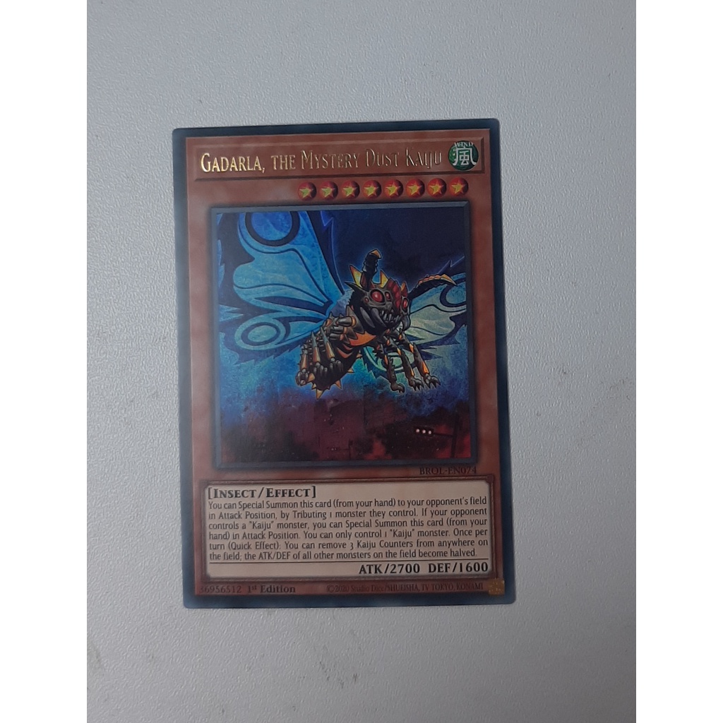 THẺ YUGIOH MÃ BROL-EN074 - Gadarla, the Mystery Dust Kaiju - Ultra Rare 1st Edition