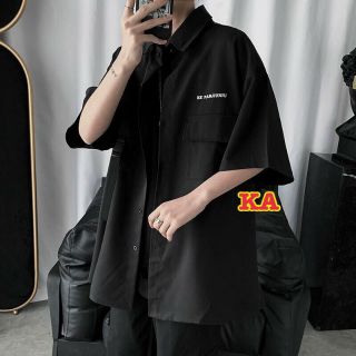 Áo sơ mi đen túi hộp khuy cài
