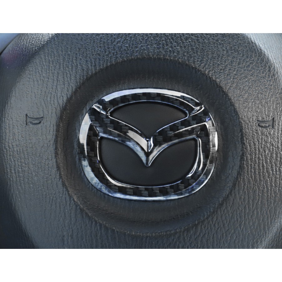 Ốp trang trí logo Cacbon trên vô lăng xe Mazda 3,6,CX5,