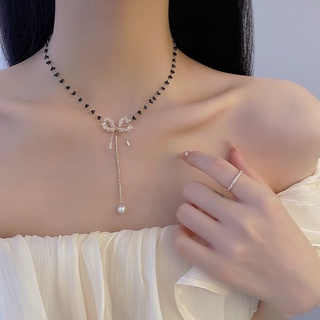 Vòng cổ hạt cườm đen nơ trắng