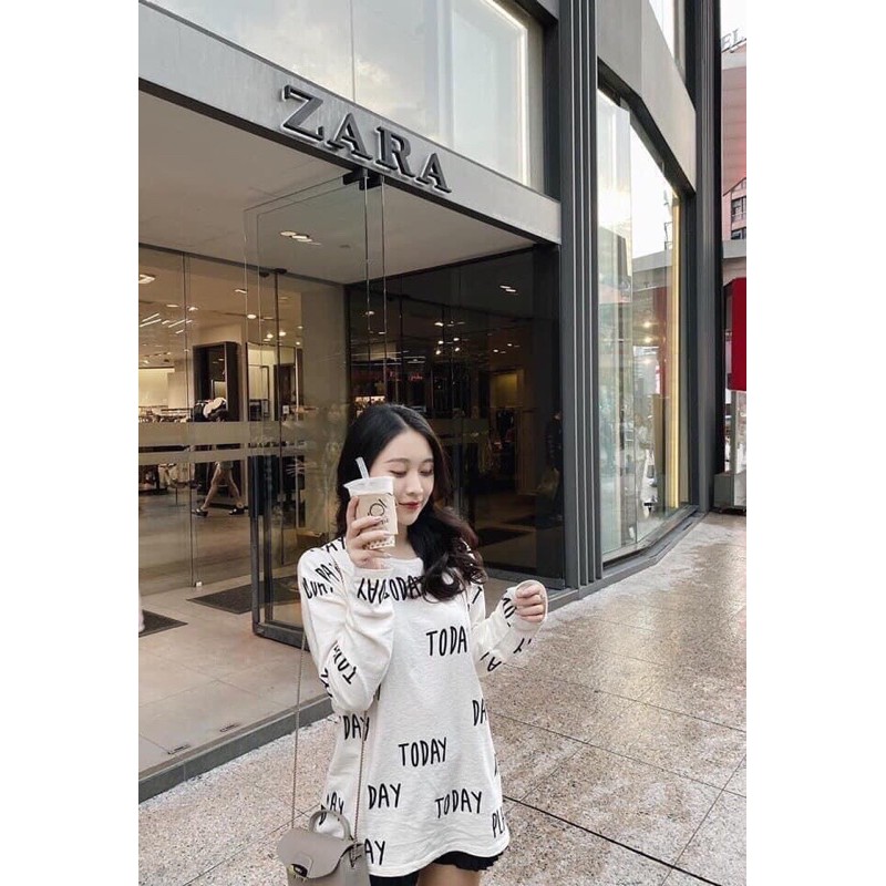 Áo trắng len giấy chữ đen