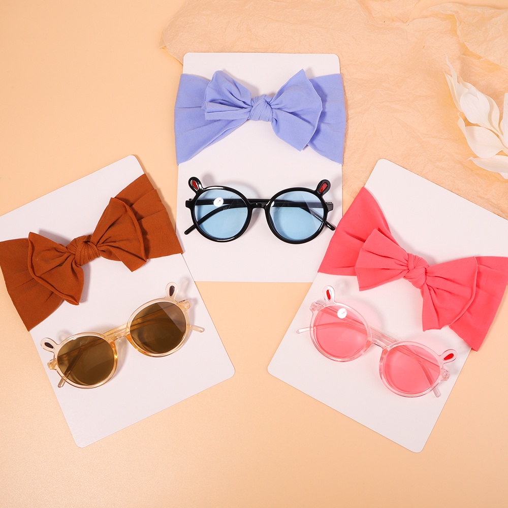 Set 2 phụ kiện KIDSBOWS gồm băng đô nơ chất liệu nylon co giãn và kính mát thời trang đáng yêu cho bé gái
