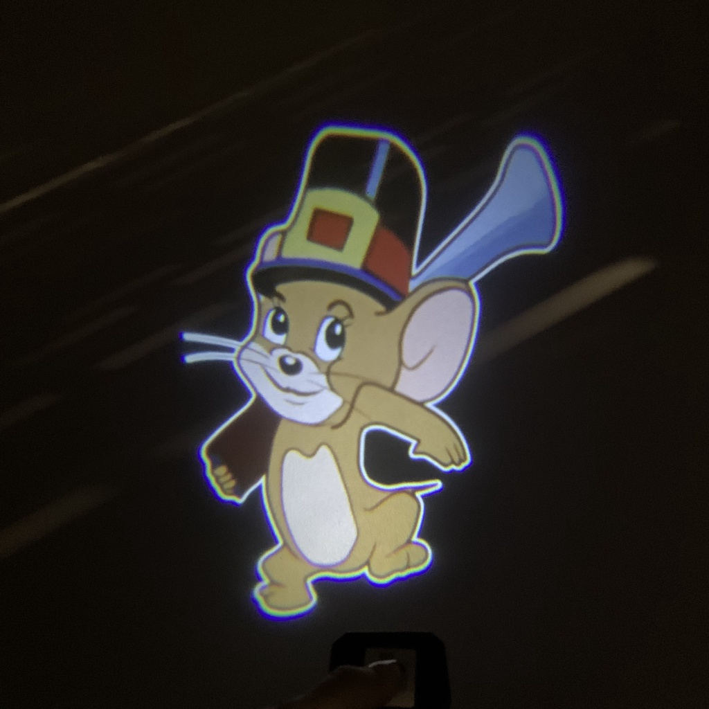 Đèn led gắn xe, đèn led trang trí laser không dây hình hoạt hình gắn cửa xe hơi xe máy