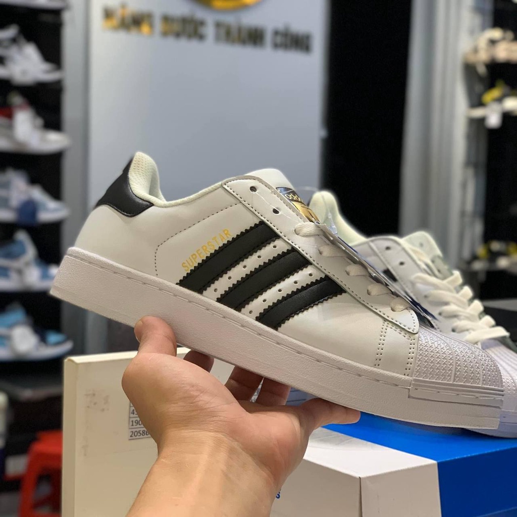 Giày thể thao nam nữ addidas sọc đen tem vàng lai au cao cấp