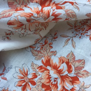 Vải linen bột hoa mẫu đơn màu cam đất.