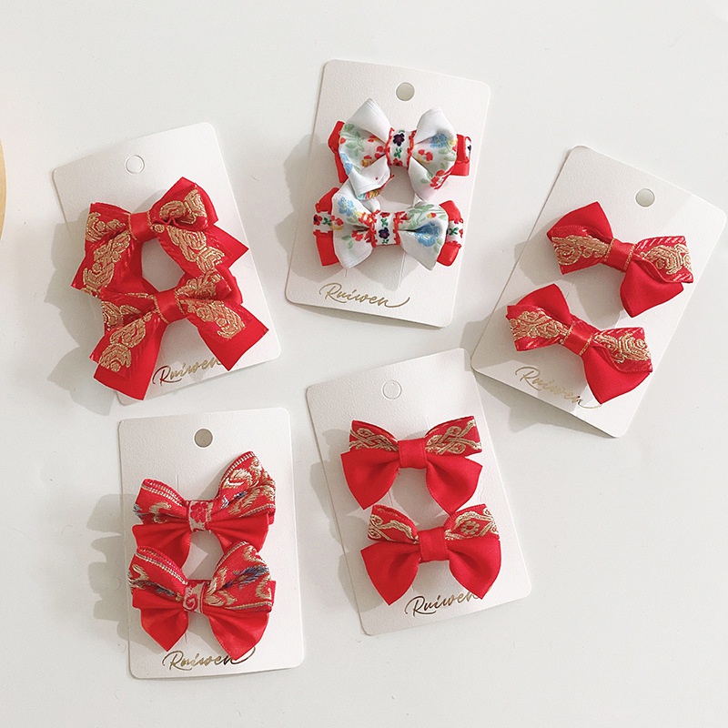 Bộ 2 kẹp tóc màu đỏ xinh xắn nhiều kiểu dáng làm quà tặng mừng năm mới cho bé gái