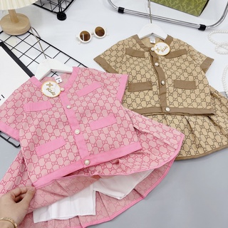 Set váy GC in tràn cổ tròn đính cúc ngọc bé gái
