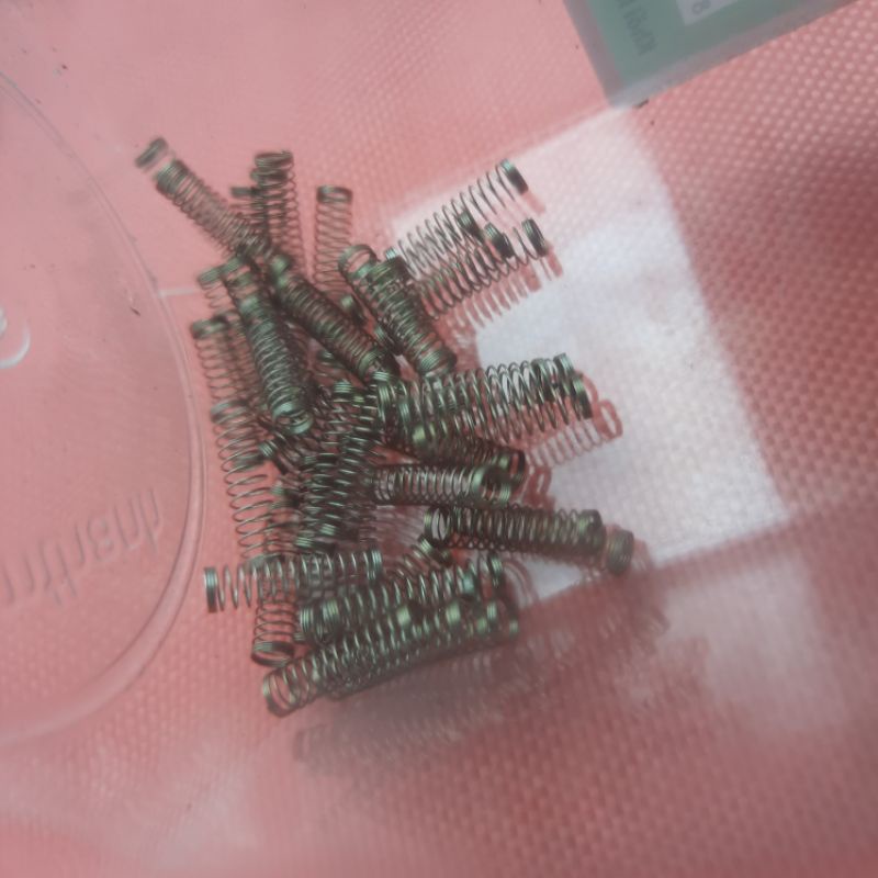 Lò xo siêu nhỏ, lực nén nhẹ như ấn bàn phím máy tính.