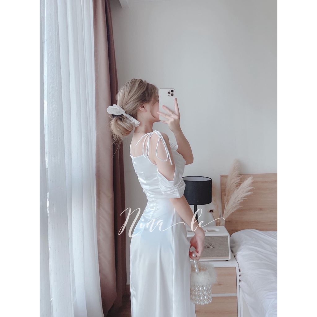 Đầm váy dự tiệc hai dây trễ vai xếp ly ngực màu trắng tinh khôi giúp nàng nổi bật. | WebRaoVat - webraovat.net.vn