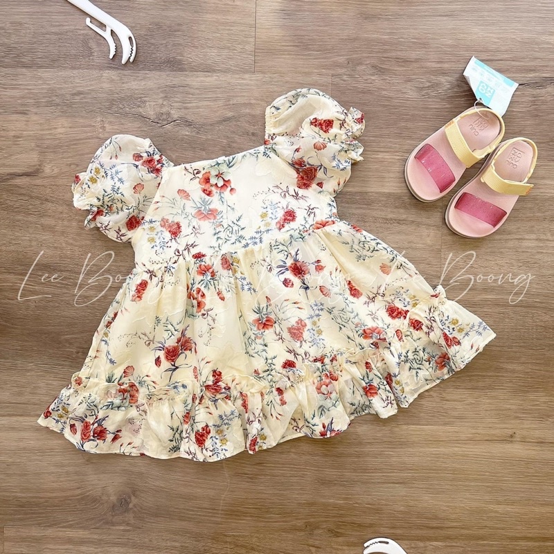 VB264 -  VÁY BÉ GÁI MÀU BE NỀN HOA CAM CHUN TAY