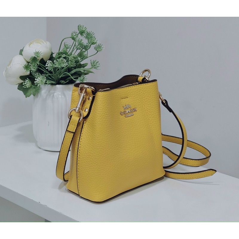 Túi Coach bucket mini hoạ tiết - nhiều màu
