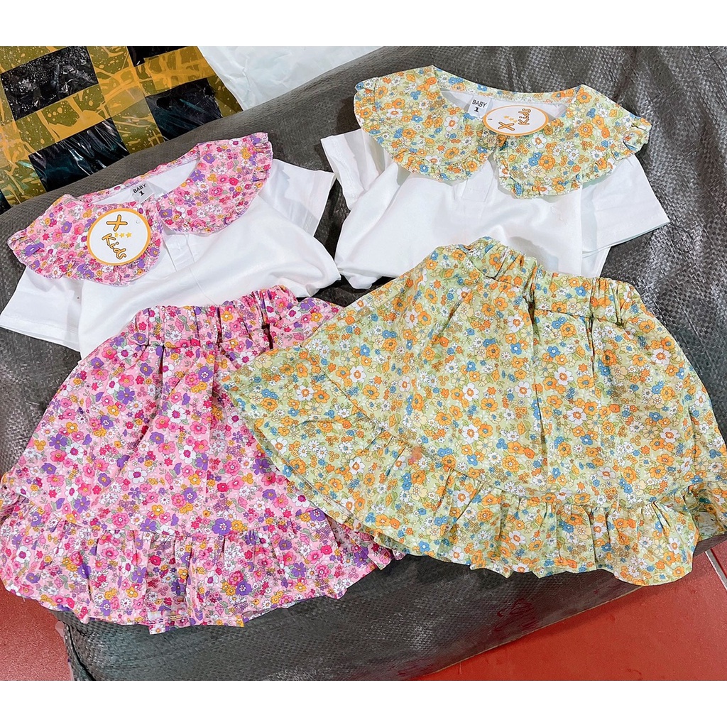 Bộ bé gái trắng cổ sen tròn hoa và chân váy đuôi cá hoa nhí liền quần XHN881