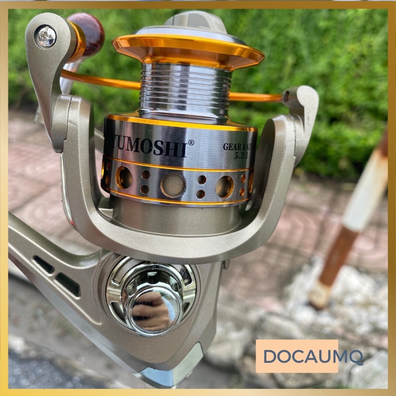 Máy câu cá Yumoshi LC vàng đồng núm gỗ giá rẻ chất lượng cao chuyên cá câu hồ ao cần máy khoẻ khắn hình thức bền đẹp
