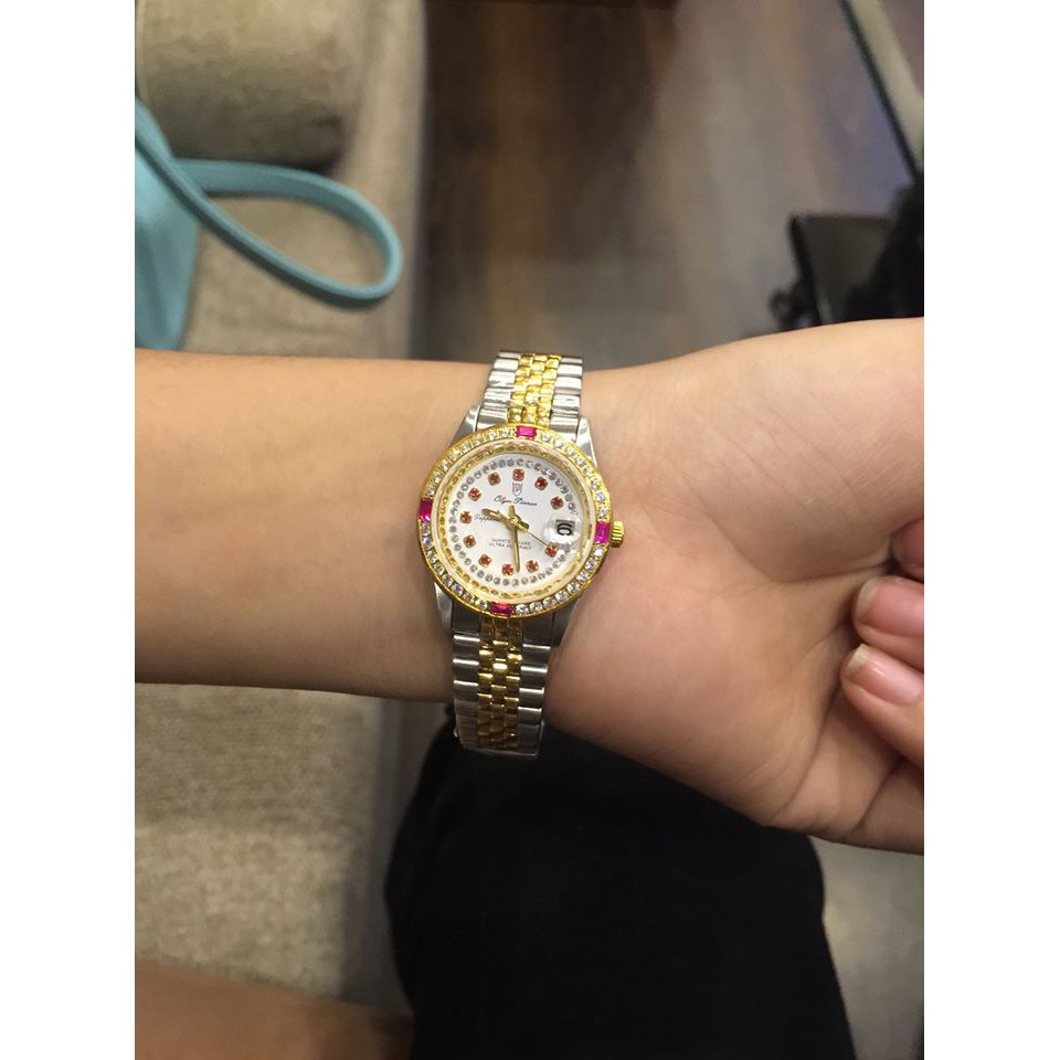 Đồng hồ nữ mặt kính sapphire Olym Pianus OP68322 DLSK trắng hạt đỏ