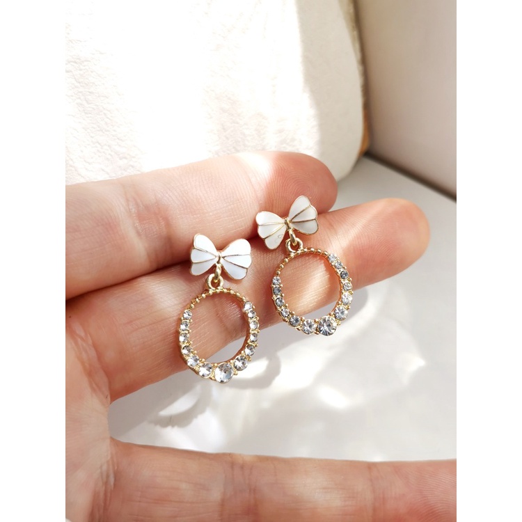 Hoa tai nơ hình tròn nữ tính