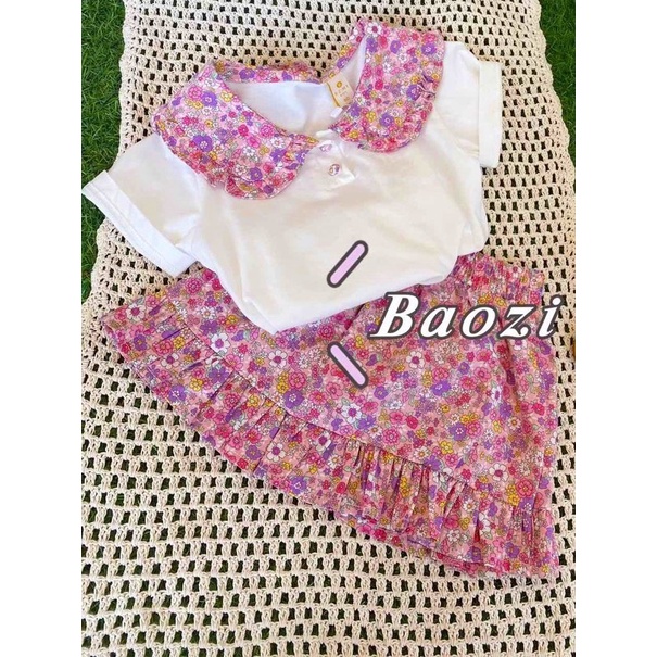 Bộ bé gái trắng cổ sen tròn hoa và chân váy đuôi cá hoa nhí liền quần XHN881