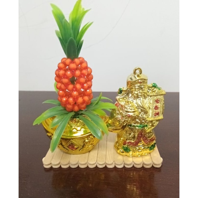 Tượng ông Thần Tài thỏi vàng trái thơm kích hoạt may mắn tài lộc