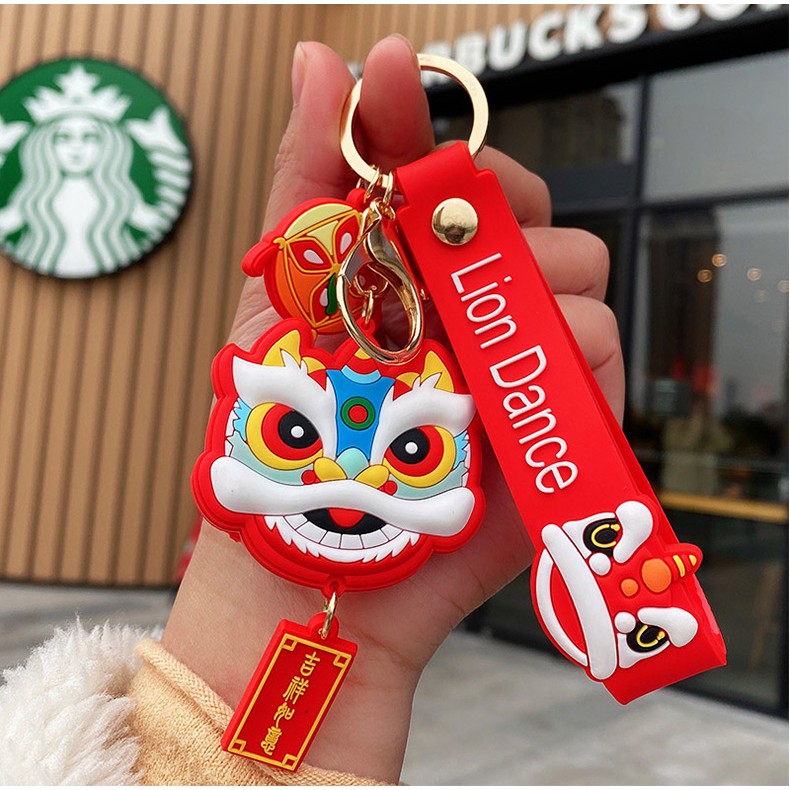 Móc khóa nhựa dẻo hình đầu Lân cá tính