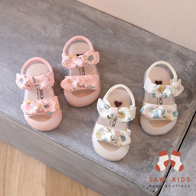 Sandal tập đi chống vấp phối nơ hình Bông hoa mũi có đế chống trơn trượt kiểu dáng Hàn Quốc mới nhất M865