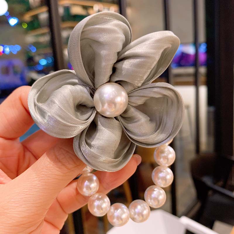Dây buộc tóc WE FLOWER chất liệu cao su co giãn đính hạt ngọc trai và hoa đáng yêu cho nữ