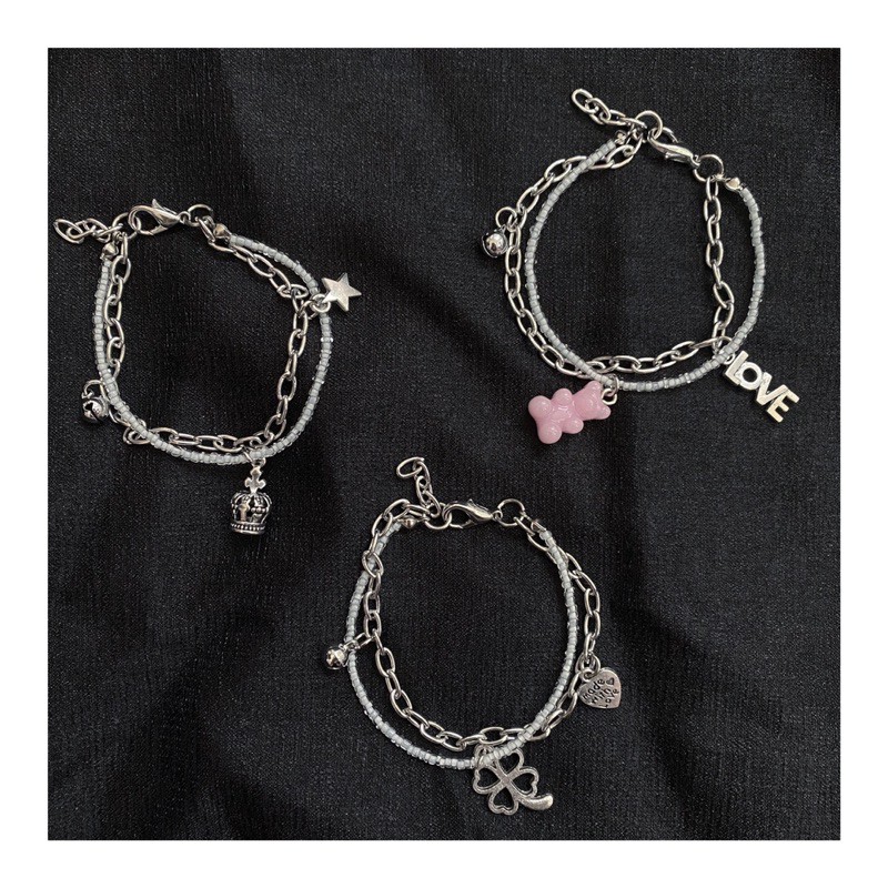 Vòng cườm trắng mix charm