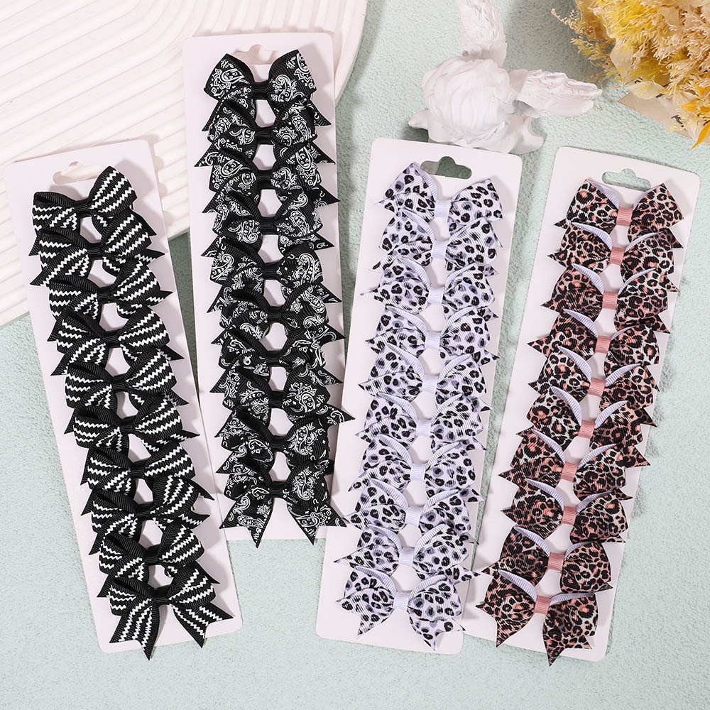 Set 10 kẹp tóc KIDSBOWS đính nơ họa tiết da báo cho bé gái