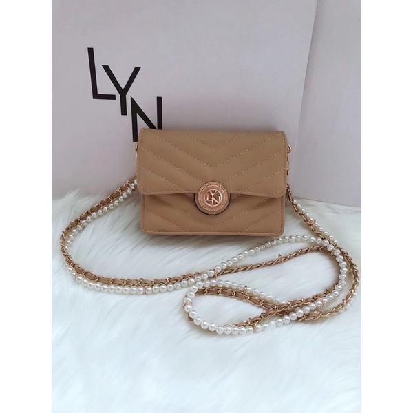 Túi lyn khoá tròn mini đeo chéo dây hạt ngọc