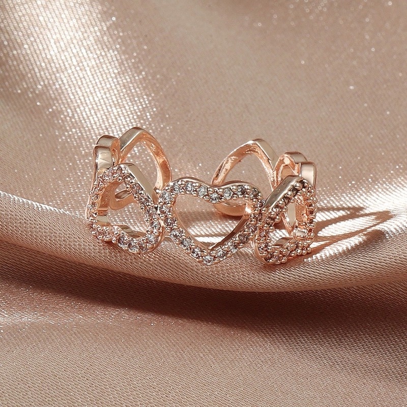 Elegant open-cut heart-shaped ring with zircon stones for women