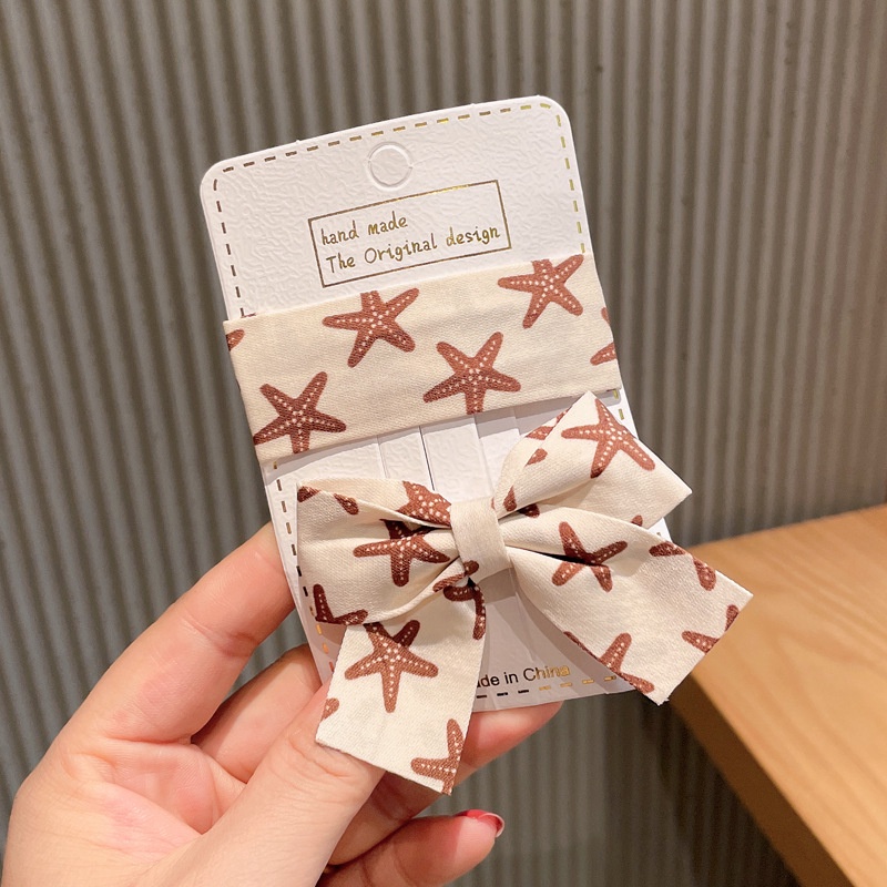 Kẹp tóc bb dáng vuông và nơ buộc làm từ vải họa tiết sao biển bắt mắt