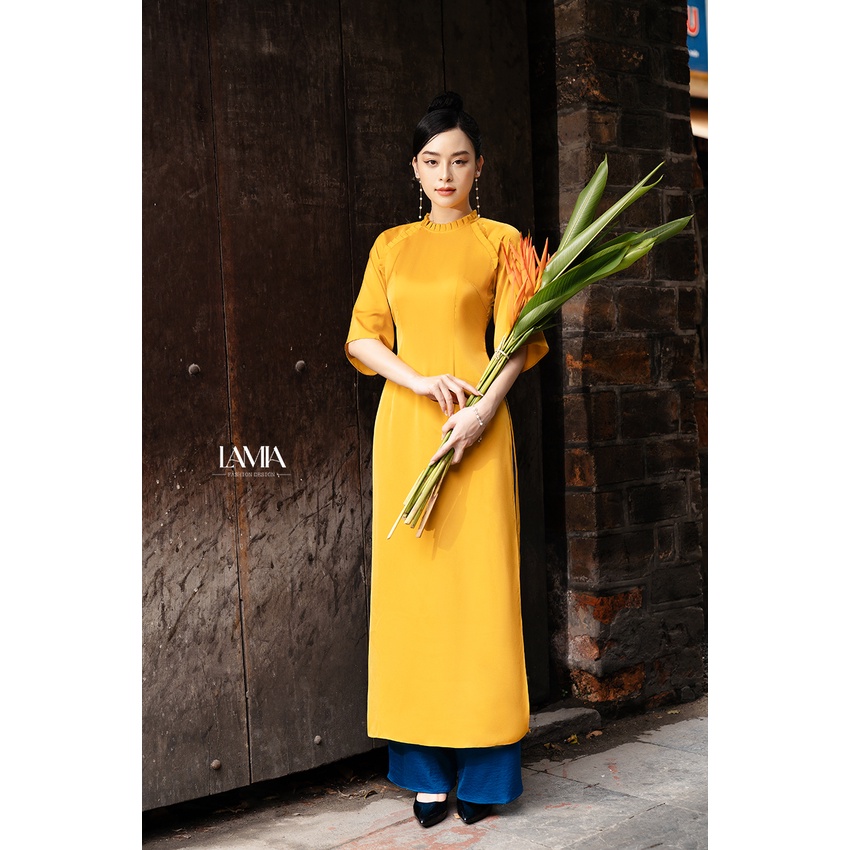 Áo dài truyền thống Lamia Design AD081 lụa Hàng Châu màu vàng cam cách điệu bèo nhún tinh tế